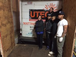  Cascade Alliance Director Sue Palmer emoting enough joy to cover all the guys working at mattress recycling at UTEC in Lowell, MA.
