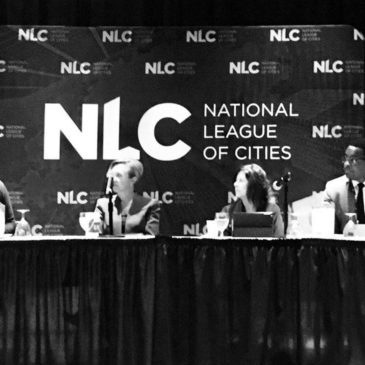 Photo: Stacy Mitchell moderates panel at NLC.