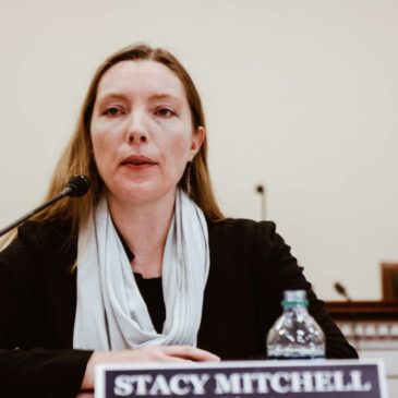 Photo: Stacy Mitchell speaking at Congressional briefing.