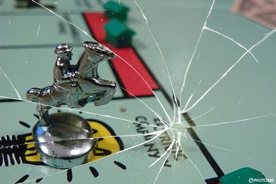 Photo of Electric Company space on Monopoly board, with broken glass effect
