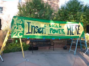 Banner from Boulder's Clean Local Power campaign